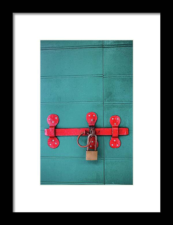 Toughness Framed Print featuring the photograph Old Wooden Doors Locked By Rusty Padlock by Dejan Kolar