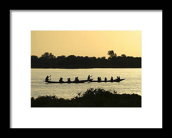 Tranquility Framed Print featuring the photograph Paddling on the Niger River at sunset by Shanna Baker