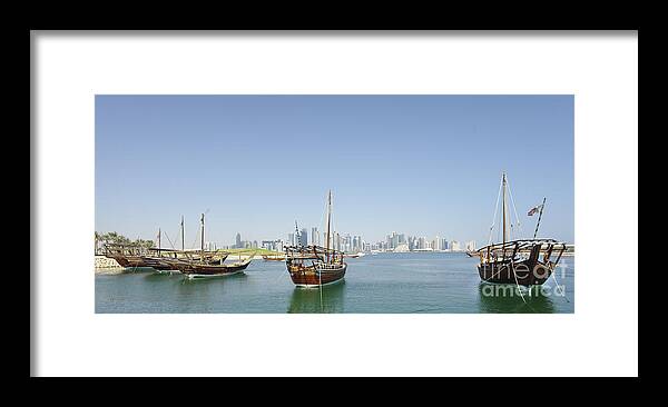 Dhow Framed Print featuring the photograph Panoramic dhows and Qatar skyline by Paul Cowan
