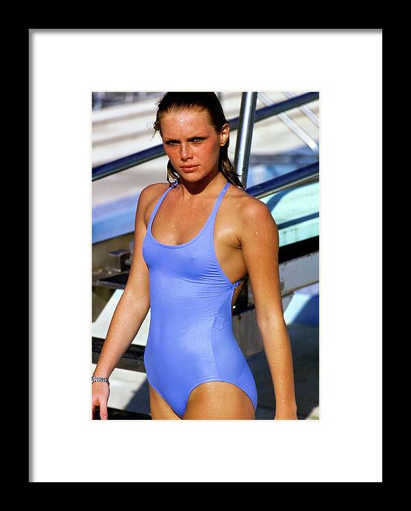 Swimwear Framed Print featuring the photograph Patti Hansen Wearing A Blue Swimsuit by Arthur Elgort
