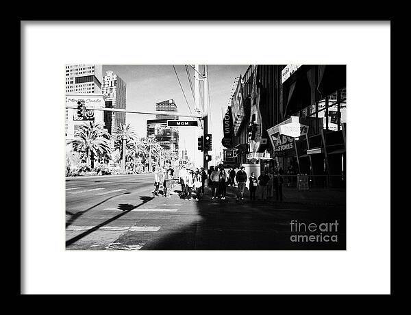 People Framed Print featuring the photograph people waiting to cross at intersection on south Las Vegas boulevard strip Nevada USA by Joe Fox