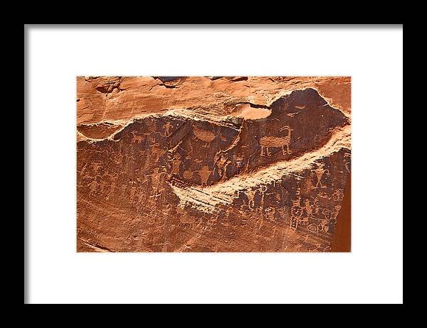 Indian Framed Print featuring the photograph Petroglyphs or Rock Art in Utah by Jean Clark