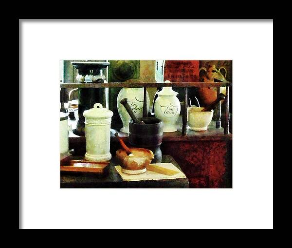 Mortar And Pestle Framed Print featuring the photograph Pharmacist - Mortar Pestles and White Jars by Susan Savad