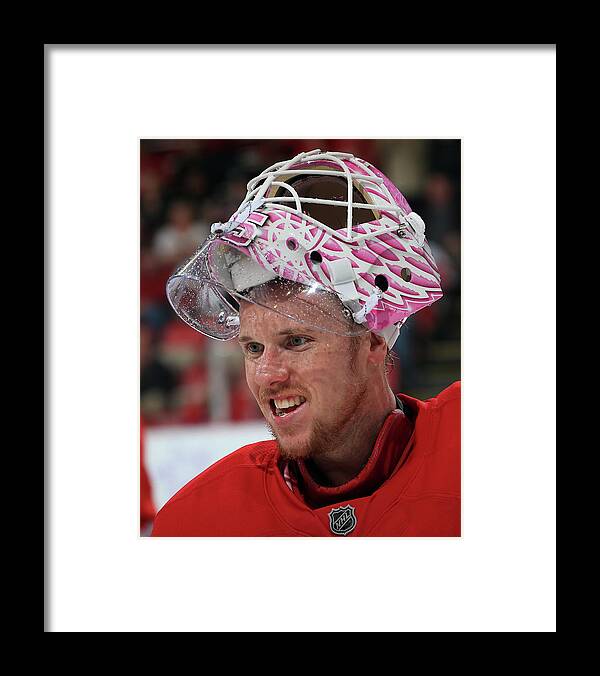 Hockey Fights Cancer Framed Print featuring the photograph Pittsburgh Penguins V Detroit Red Wings by Dave Reginek