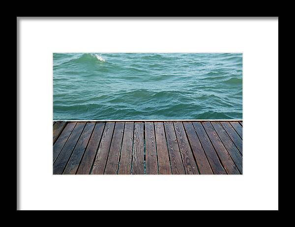 Water's Edge Framed Print featuring the photograph Platform Beside Sea by Mbtphotos