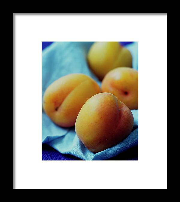 Fruits Framed Print featuring the photograph Plumcots by Romulo Yanes