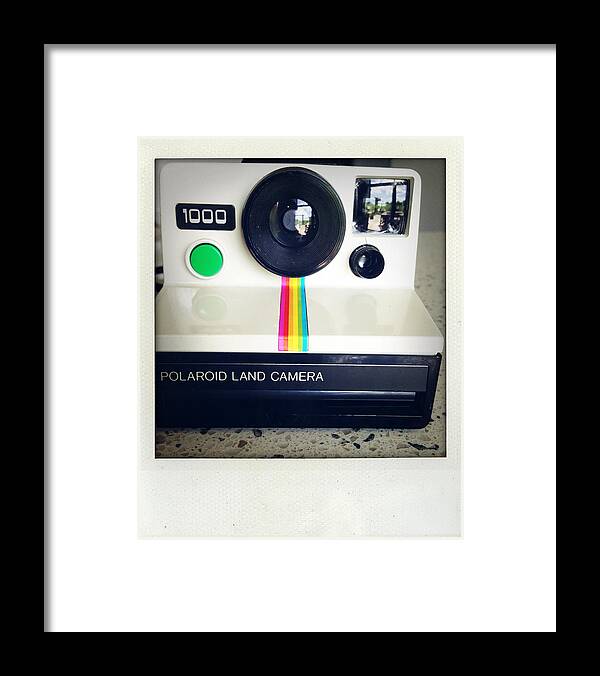 Aged Framed Print featuring the photograph Polaroid camera. by Les Cunliffe