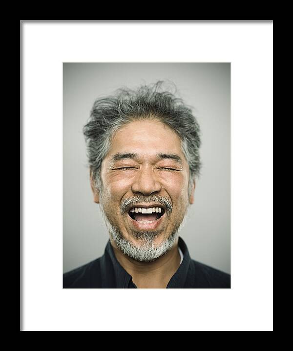 Asian And Indian Ethnicities Framed Print featuring the photograph Portrait of a happy real japanese man with grey hair. by SensorSpot