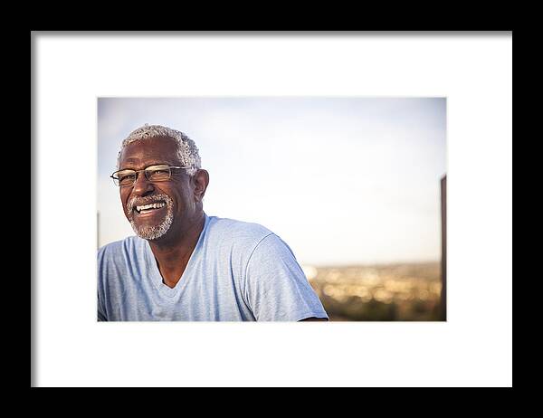 Mature Adult Framed Print featuring the photograph Portrait of a Smiling Senior Black Man by Adamkaz