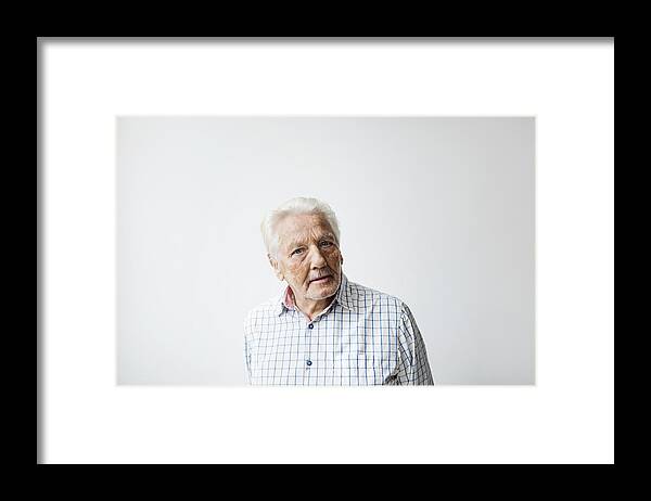 People Framed Print featuring the photograph Portrait of confident senior man standing against white background by Maskot