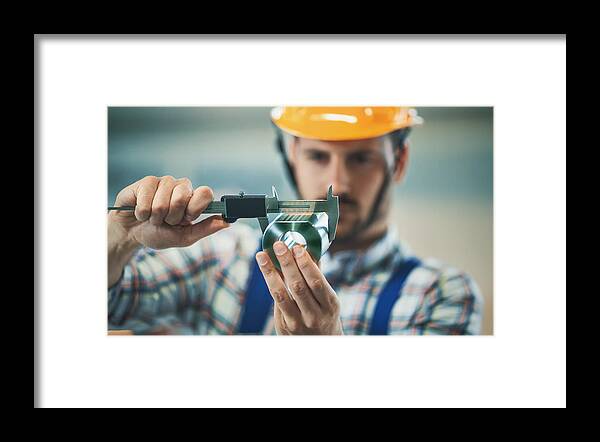 Expertise Framed Print featuring the photograph Product inspection. by Gilaxia