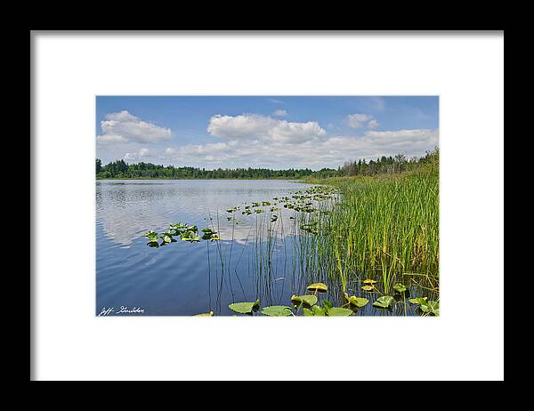 Beauty In Nature Framed Print featuring the photograph Puffy Clouds Reflected in a Lake by Jeff Goulden