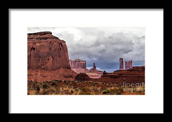 Monument Valley Framed Print featuring the photograph Rain Over the Monuments by Jim Garrison