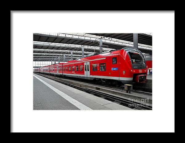 Train Framed Print featuring the photograph Red commuter train parked at Munich station Germany by Imran Ahmed