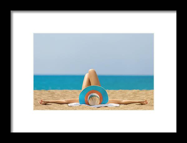 Straw Hat Framed Print featuring the photograph Relaxing and Sunbathing at Beach by Bymuratdeniz