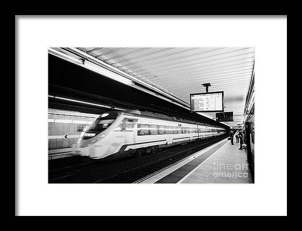 Passeig Framed Print featuring the photograph renfe civia train speeding through passeig de gracia underground main line train station Barcelona C by Joe Fox
