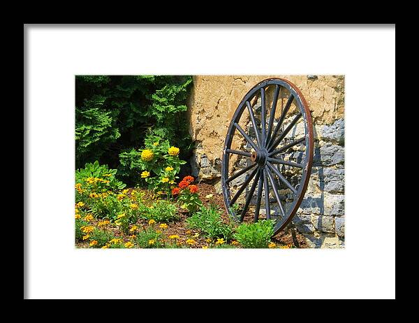 Stone Barn Framed Print featuring the photograph Retired Wagon Wheel by Jeanette Oberholtzer