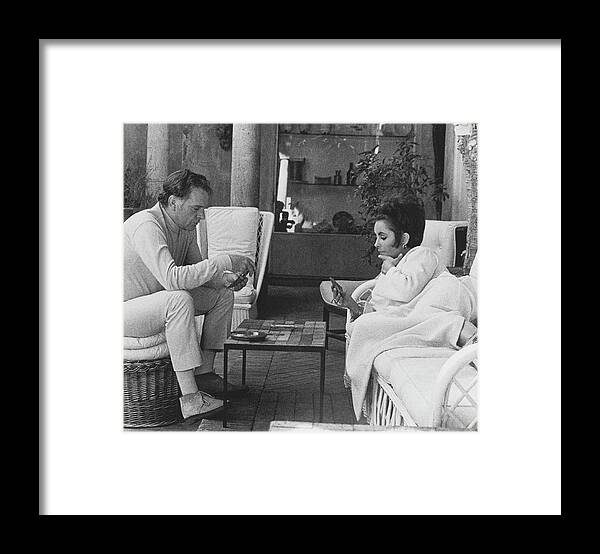 Actor Framed Print featuring the photograph Richard Burton And Elizabeth Taylor Playing Gin by Henry Clarke