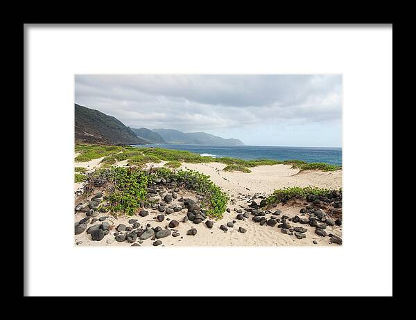 Honolulu Framed Print featuring the photograph Rocks And Greenery In The Sand Leading by Brandon Tabiolo / Design Pics
