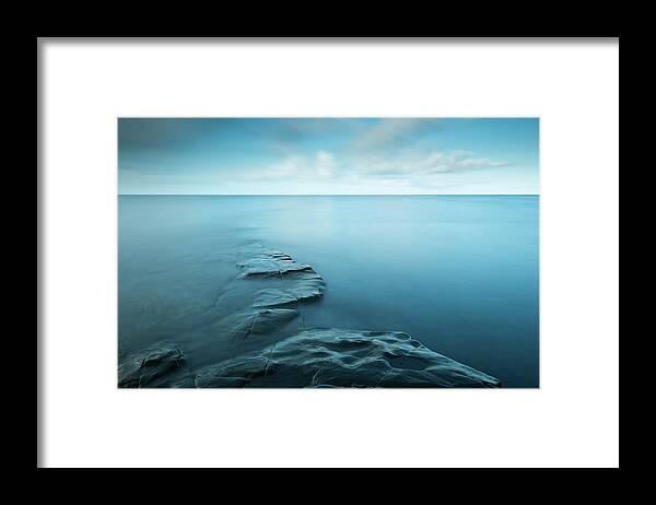 Tranquility Framed Print featuring the photograph Rocks Being Covered By An Incoming Tide by Jeremy Walker