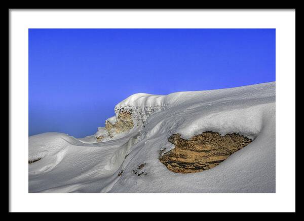 Rocks Framed Print featuring the photograph Rocks Covered With Snow Against Clear Blue Sky by Vlad Baciu