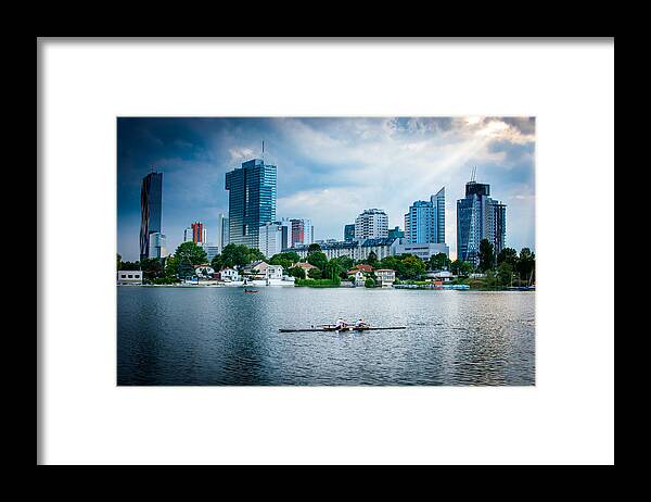 Skyline Framed Print featuring the photograph Rowing Boat And The Skyline Of Vienna by Andreas Berthold