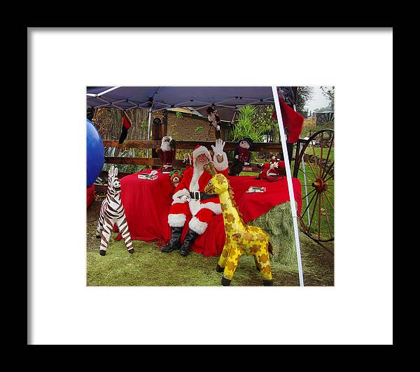 Santa Claus Framed Print featuring the photograph Santa Clausewith the Animals by Phyllis Spoor