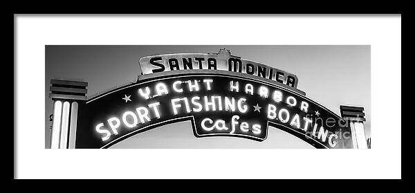 America Framed Print featuring the photograph Santa Monica Pier Sign Panoramic Black and White Photo by Paul Velgos