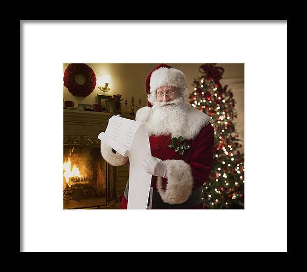 People Framed Print featuring the photograph Santa reading list by Jose Luis Pelaez Inc