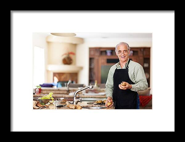 Mature Adult Framed Print featuring the photograph Senior man preparing to wash potatoes by Lise Gagne