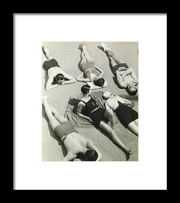 Exterior Framed Print featuring the photograph Simone Demaria And Models Sunbathing On A Beach by George Hoyningen-Huene