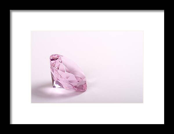 White Background Framed Print featuring the photograph Single pink diamond on white background copyspace right by Ebrink