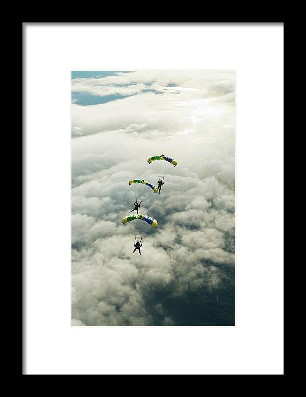 Young Men Framed Print featuring the photograph Skydivers In Mid-air by Johner Images