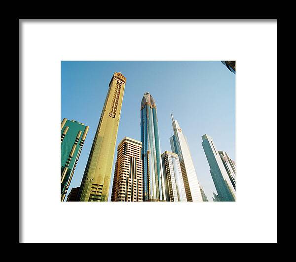 Financial District Framed Print featuring the photograph Skyscrapers Along Sheikh Zayed Road At by Gary Yeowell
