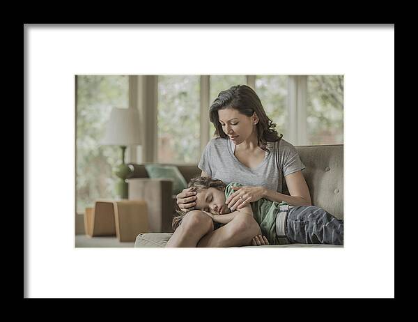 4-5 Years Framed Print featuring the photograph Sleeping boy laying in lap of mother by Terry Vine