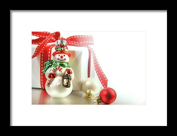 Background Framed Print featuring the photograph Small christmas ornament with gift by Sandra Cunningham