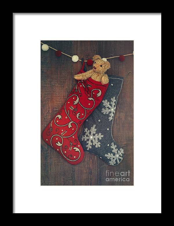 Abstract Framed Print featuring the photograph Small teddy bear in stocking for Christmas by Sandra Cunningham