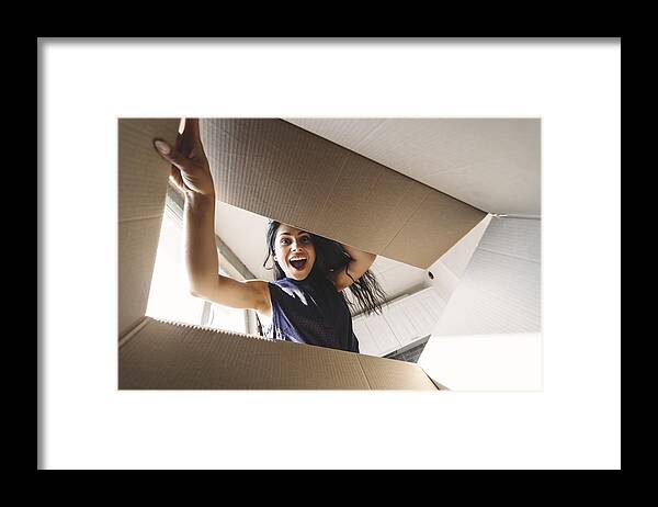 Bulgaria Framed Print featuring the photograph Smiling woman opening a carton box by Elitsa Deykova