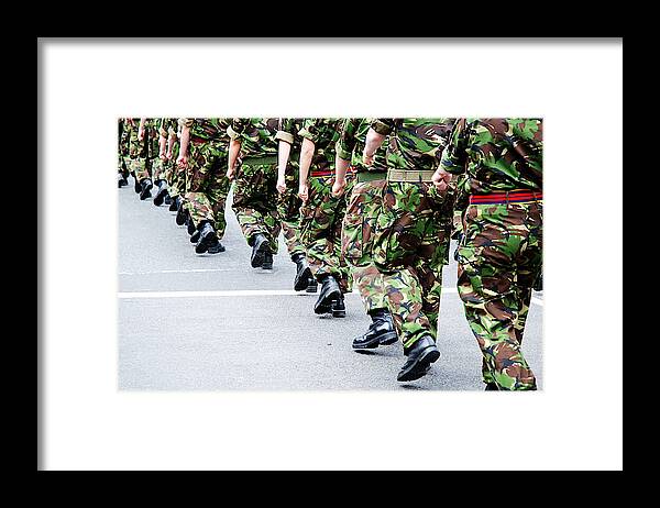 Marching Framed Print featuring the photograph Soldiers marching in line by Ilbusca