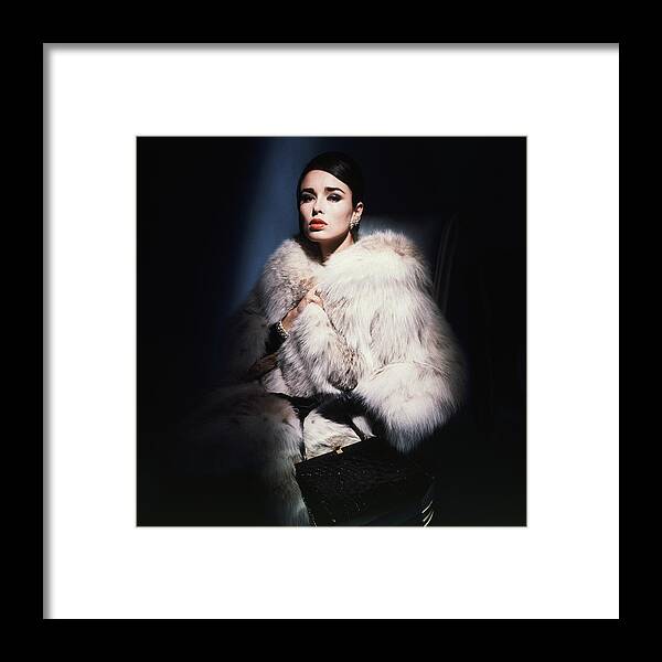 Studio Shot Framed Print featuring the photograph Sondra Peterson Wearing White Fur Coat by Horst P. Horst
