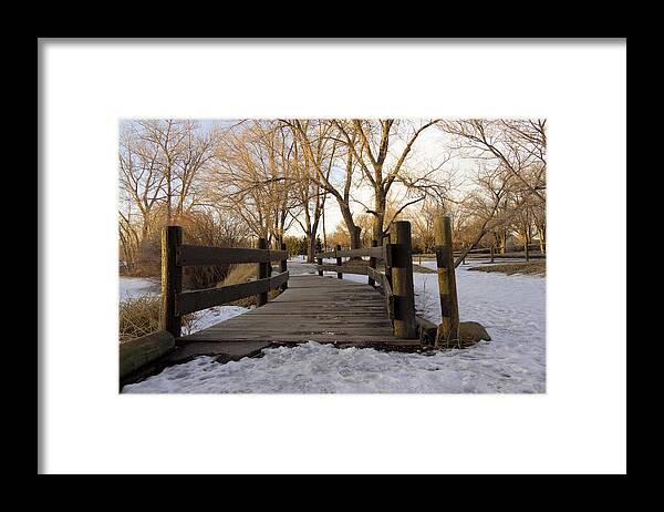 Snow Framed Print featuring the photograph Spring Meadow Lake in Helena Montana during golden hour. by Dana Moyer