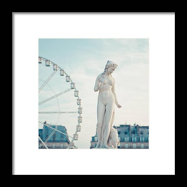 Statue Framed Print featuring the photograph Statue of naked lady and carrousel in back by Cindy Prins