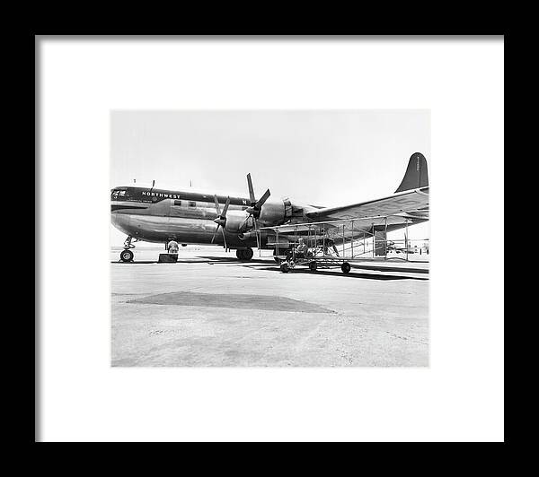 1 Person Framed Print featuring the photograph Stratocruiser And Biplane by Underwood Archives