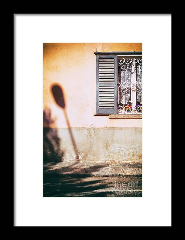 Architecture Framed Print featuring the photograph Street lamp shadow and window by Silvia Ganora