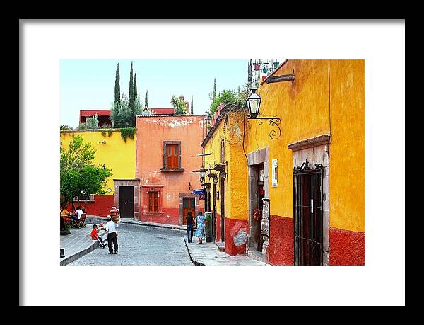 Cobblestone Framed Print featuring the photograph Street Life in San Miguel by Robert McKinstry