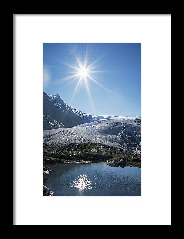 Tranquility Framed Print featuring the photograph Sun Reflecting In A Mountain Lake by Buena Vista Images