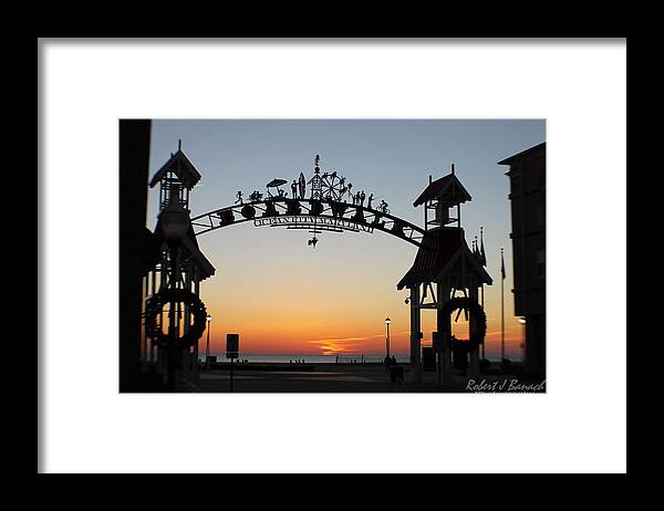 Sunrise Framed Print featuring the photograph Sun Reflecting on Clouds Ocean City Boardwalk Arch by Robert Banach