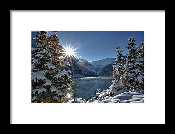 Tranquility Framed Print featuring the photograph Sun Rises Above Mountain Lake, Winter by Ascentxmedia