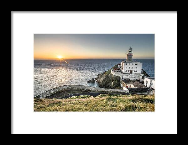 Cliff Framed Print featuring the photograph Sunrise in Baily lighthouse Dublin Ireland by Giuseppe Milo