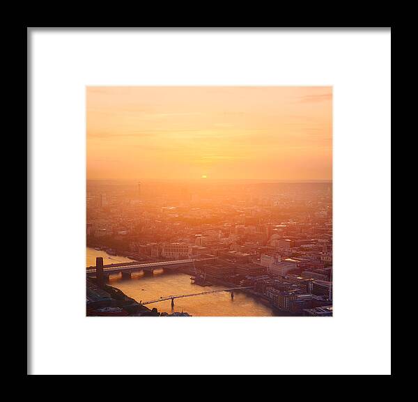 London Millennium Footbridge Framed Print featuring the photograph Sunset light in London. by Tim Robberts